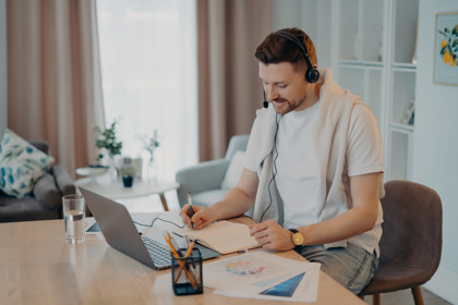 Man Makes Notes While Listening